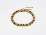 a gold chain bracelet on a white background