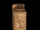 a close up of a metal object on a black background