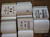 a lot of different stamps on the pages of a book