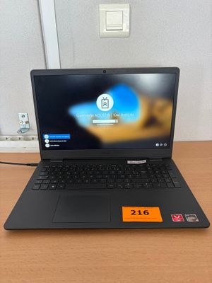 a laptop that is sitting on a table with a price tag