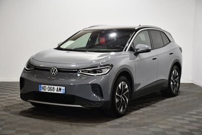 a grey volkswagen e - trac suv parked on a checkered floor