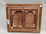 an old wooden picture frame with two open doors and a number on it