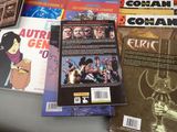 a lot of comic books sitting on a table