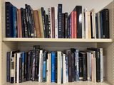 many books that are on the shelves in the room