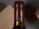 a bottle of wine that is sitting on a table