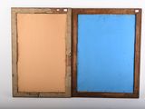 pair of wooden frames with blue and orange paint on them