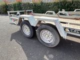 a trailer that is parked on the side of the road