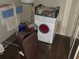 a washer and a dryer in a small room