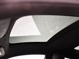 a view of the sunroof from inside of a car