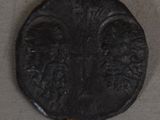 an image of a black coin on a rope