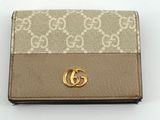 Portefeuille Guccissi avec logo GG doré sur le devant