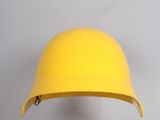 yellow hard hat on clear acrylic base against a white background