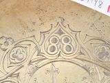 a drawing of a crown on the floor of a building