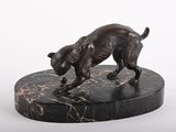 statue of a dog on a marble base on a white background