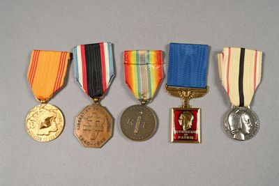 five medals that have been placed on a table