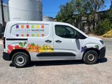 a van that is parked on the side of the road