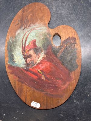 a painting of a man in a red coat on a wooden palette