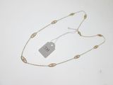 a close up of a necklace with a tag attached to it