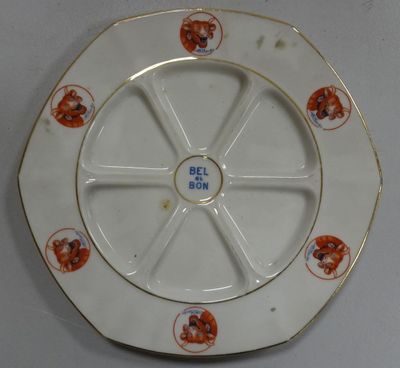 a white plate with a picture of a dog on it