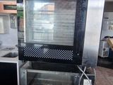 a kitchen with a stove, oven, and sink in it