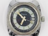 a close up of a watch on a white surface