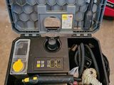 a tool box with tools in it sitting on the floor