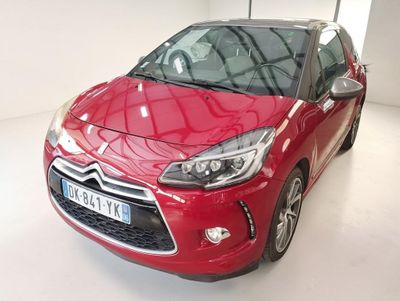 the red citrole is parked in a white room