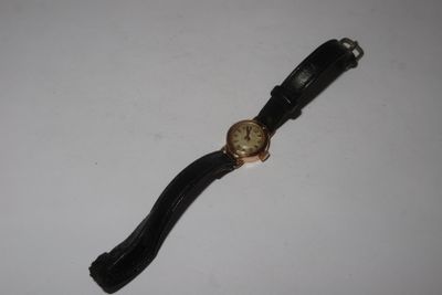 a watch that is laying on a table