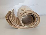 a roll of paper sitting on a table next to a wall