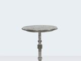 a close up of a small table on a white surface