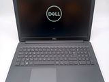 the dell laptop is open and ready to be used