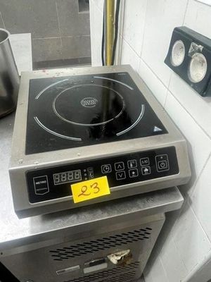 a stove with a pot on top of it in a kitchen