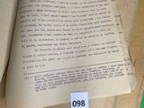an open book on a table with a bookmark on it