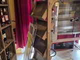 a wine cooler that is in the middle of a room