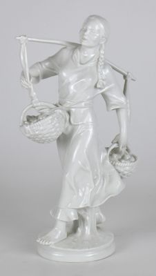 statue d'une femme tenant un panier et un chien