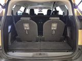 two seats in the back of a car with the doors open