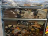 a cart that has many items in it in a warehouse