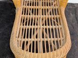 a wicker chair that is sitting on the floor