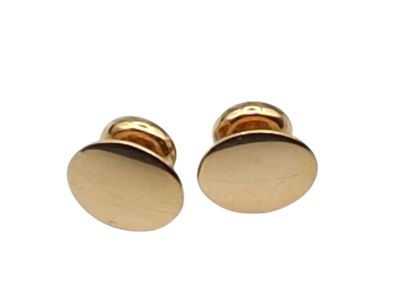 pair of gold plated cufflinks on white background