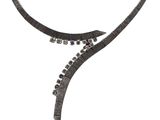 a close up of a necklace on a white background