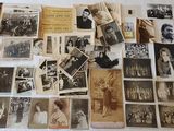 a lot of old photographs on the table together