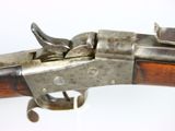 an old gun with a wooden handle on a white background