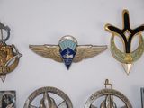 a lot of badges that are on the wall