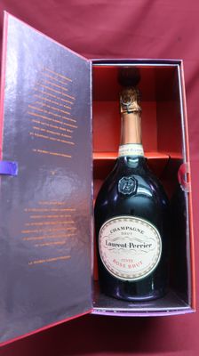 a bottle of champagne in a box on a table