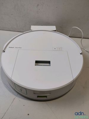 an image of a white robotic vacuum cleaner sitting on top of a white floor