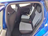 a blue car with two seats in the back of it