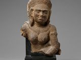 a statue of a woman with a hat on her head