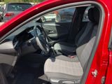 a red car that is parked in a parking lot