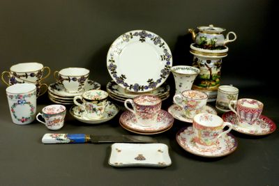 many different types of tea cups and saucers on the table