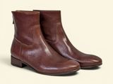 a close up of a pair of brown boots on a white background